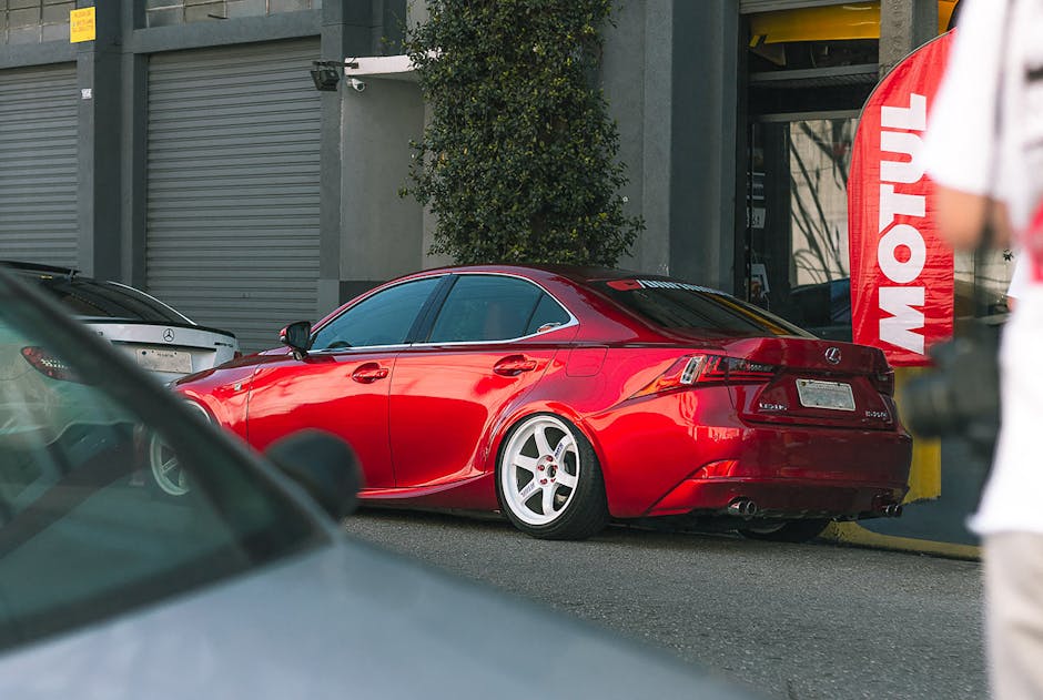 A sleek red Lexus car parked outdoors in São Paulo, showcasing luxury automotive design