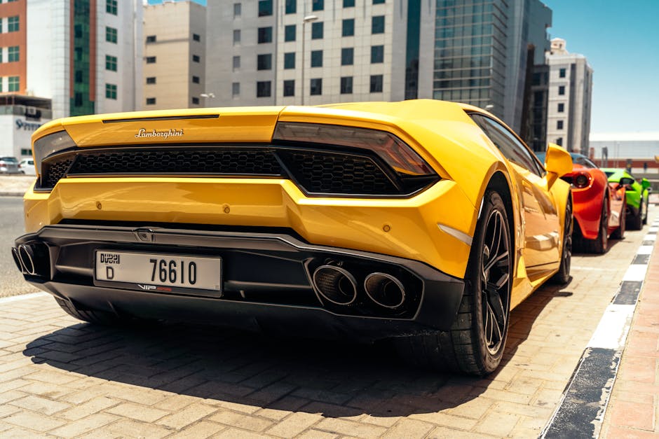 Stunning yellow Lamborghini sports car parked in downtown Dubai, showcasing luxury and speed